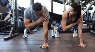 Fitness trainer demonstrating arm toning exercises Virginia Water
